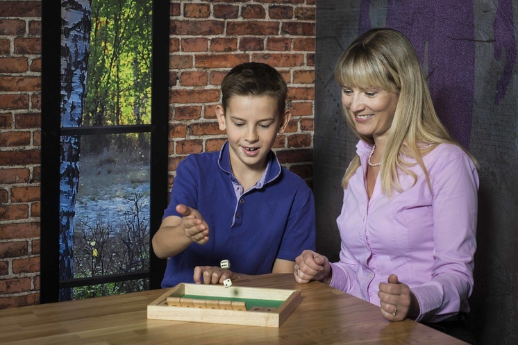 Boy and woman playing math game