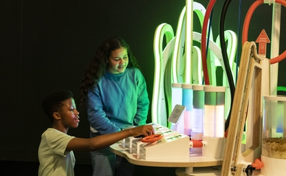 Kids exploring the "From waste to food" exhibit