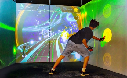 Boy playing the interactive game Exercube