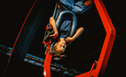 Boy cycling upside down